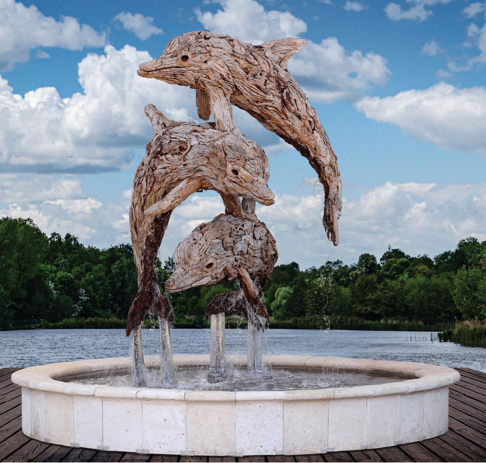 Flight – driftwood dolphin water-feature sculpture by James Doran-Webb
