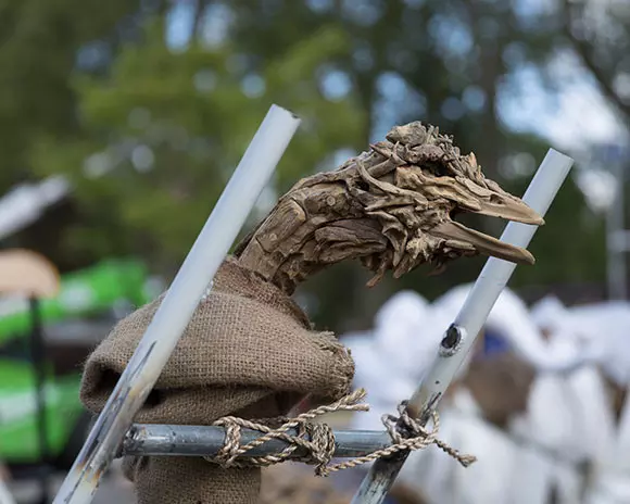 Florence the Frisky Ostrich is removed from the container safely attached to her docking frame