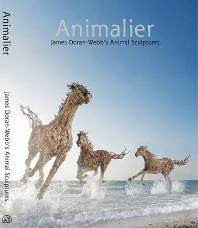 Animalier book cover featuring three driftwood horse sculptures by James Doran-Webb on a beach